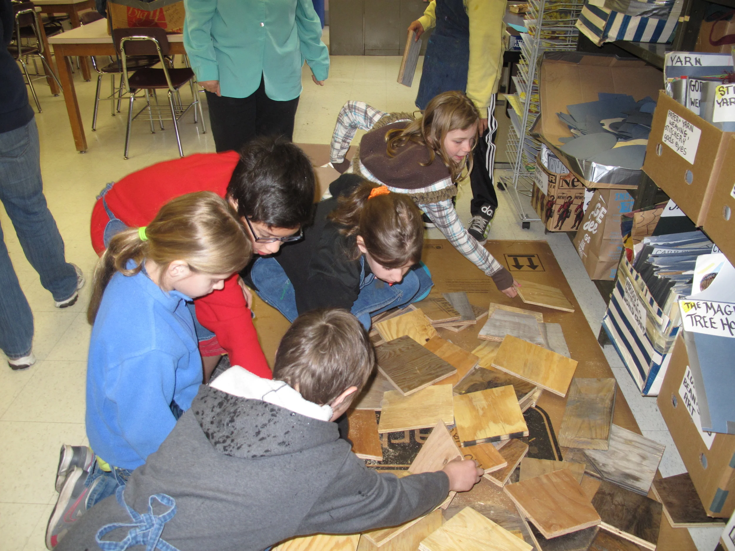 Elementary school students picking out their wood backing