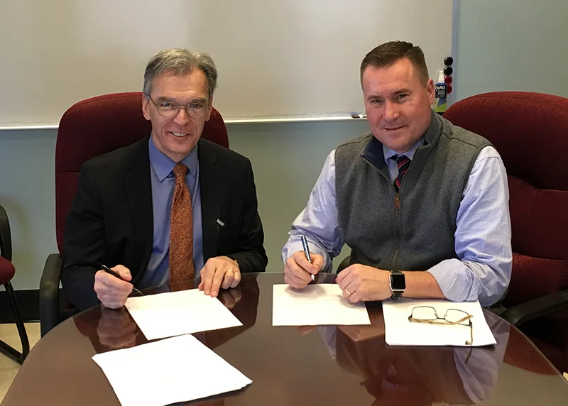 Bostonian Society President Executive Director Brian W J LeMay at the lease signing with Gregory Rooney, Commissioner of the City of Boston Property Management Department.