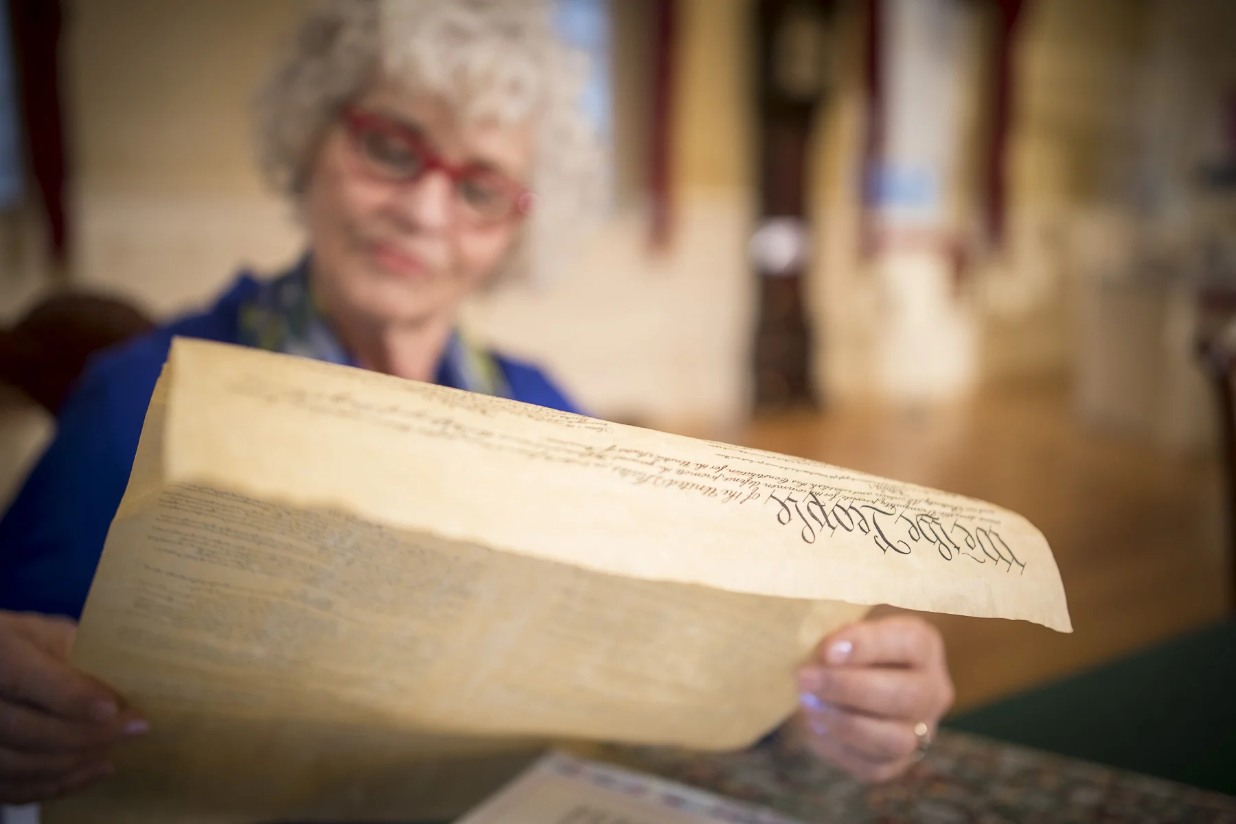 Older woman reading the US Constitution.