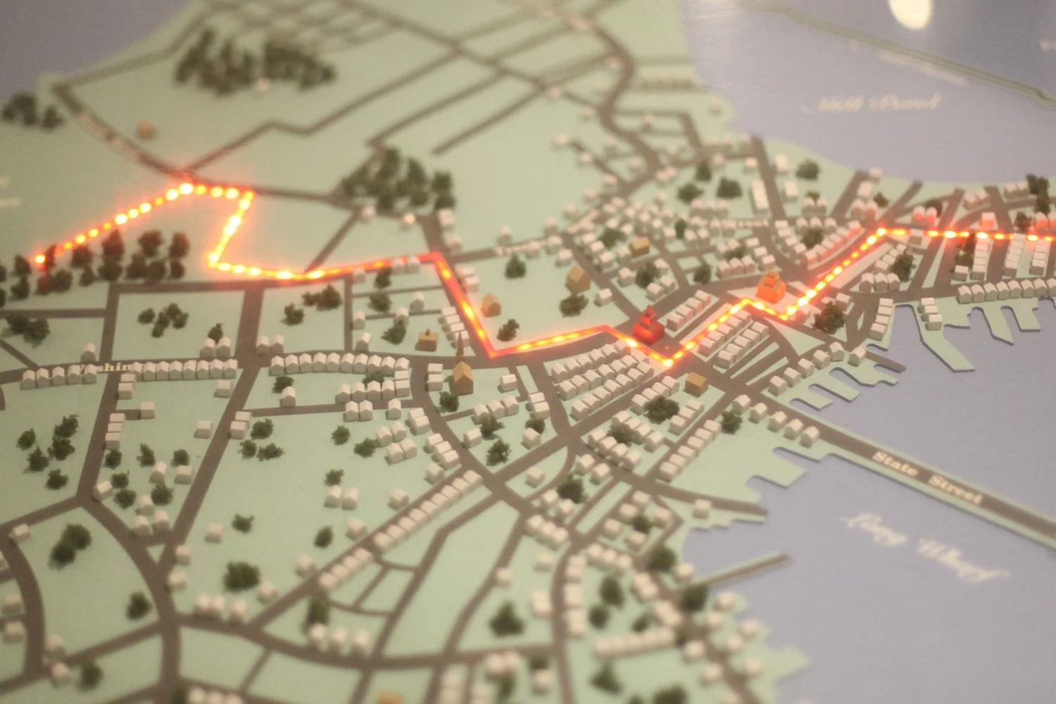 Light-up three-dimensional map of the city of Boston in the Revolutionary era.
