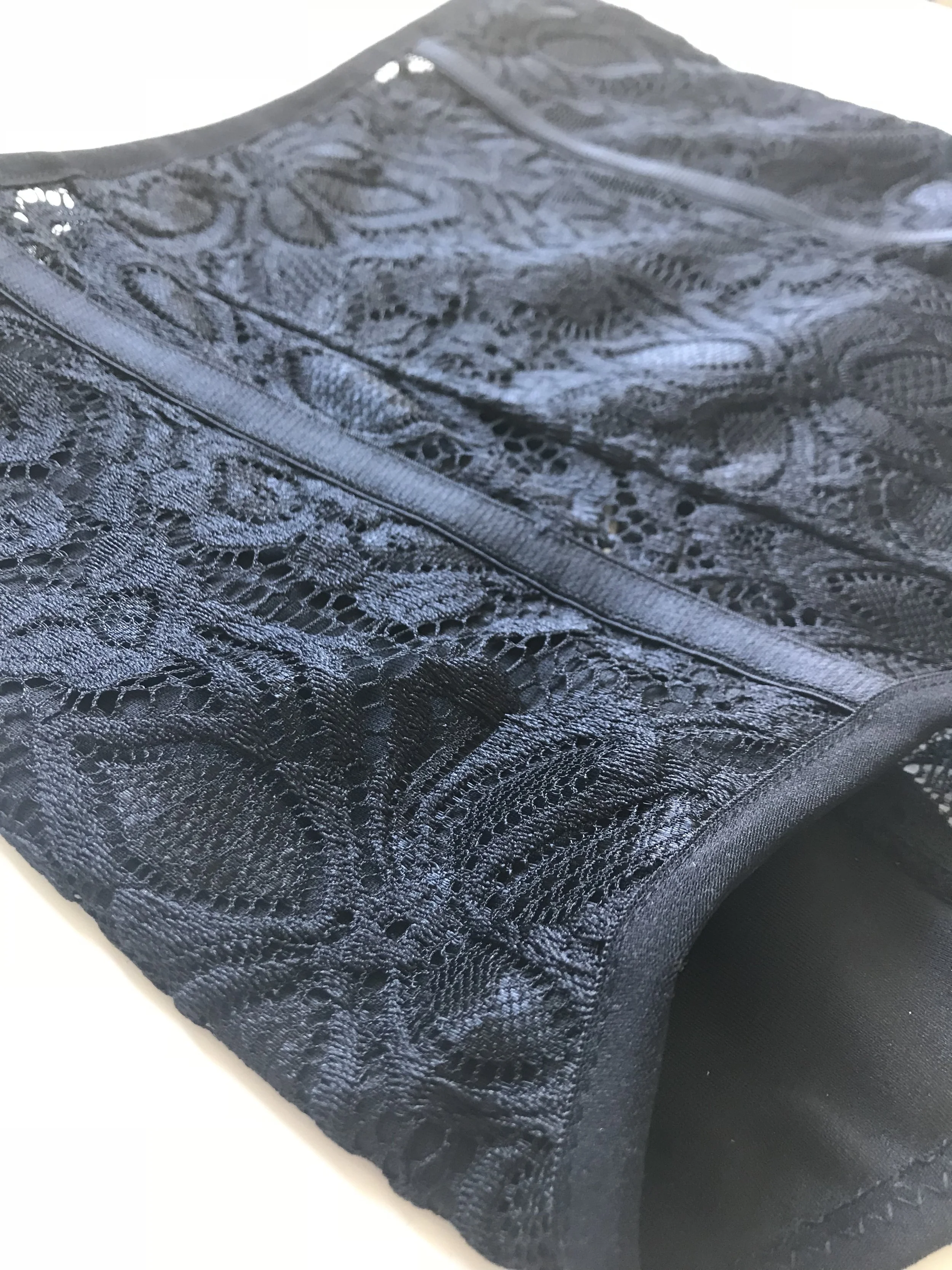 Black high waisted lace strap on harness close up