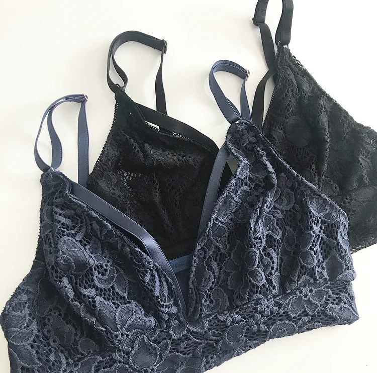 Black and blue lace bralettes flat lay