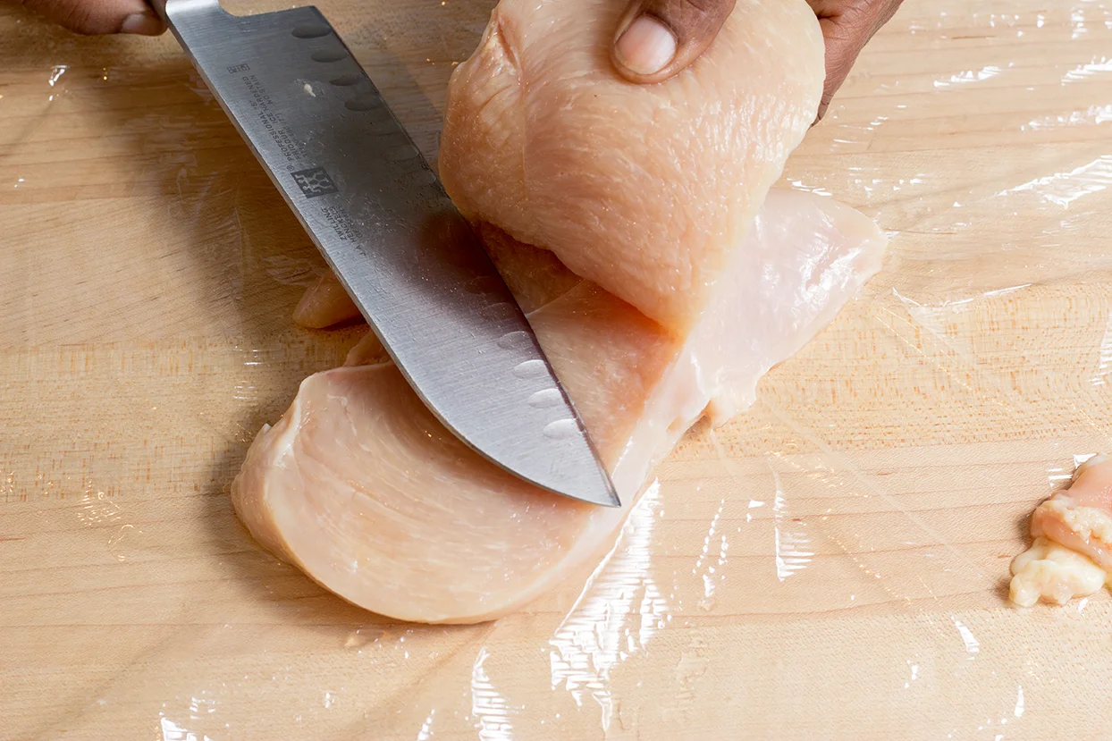 Starting at the thick end of the breast, slice it length-wise. 