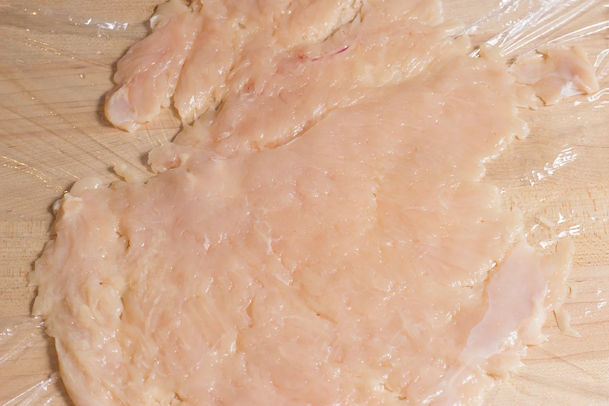 Run fingers across the flatened breast for uneven spots, pound these spots out. Spinkle cold water on breast.