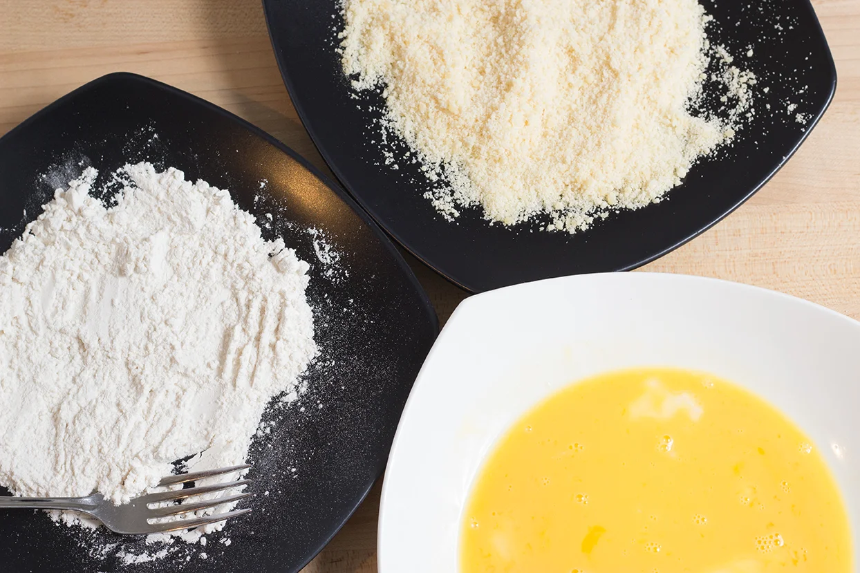 These are your breading dishes: flour, washed egg and parmesan.