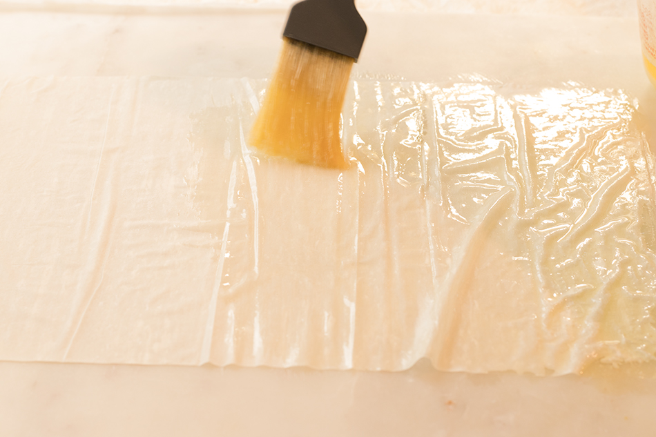 Layer and butter layers of phyllo dough.