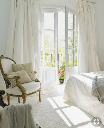Dreamy white bedroom with a classical chair source