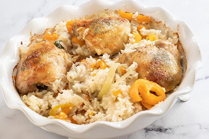 Baked tarragon chicken and rice in casserole dish and out of the oven