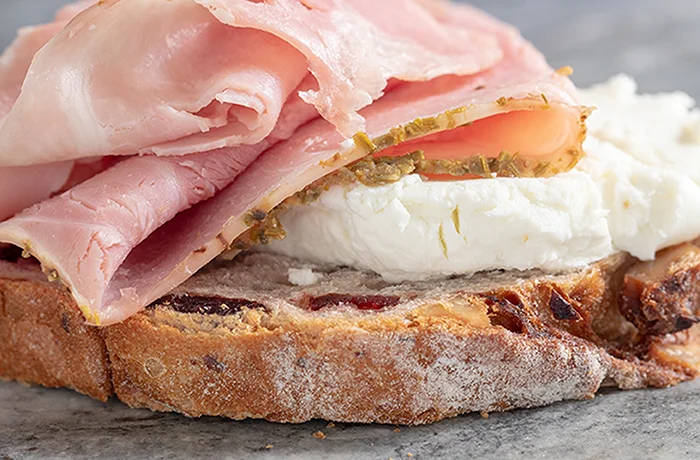 Rosemary Garlic Ham and Goat Cheese on Cranberry Walnut Round Bread