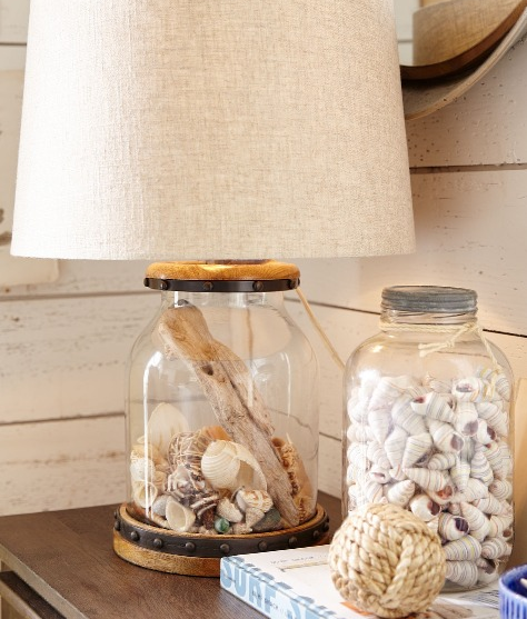 Seashell collection in fillable lamps from Complete Coastal