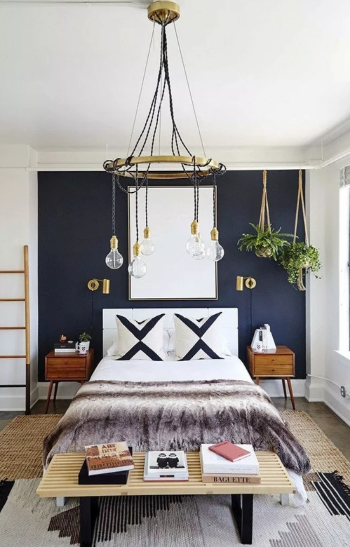 Blue accented wall in bedroom source