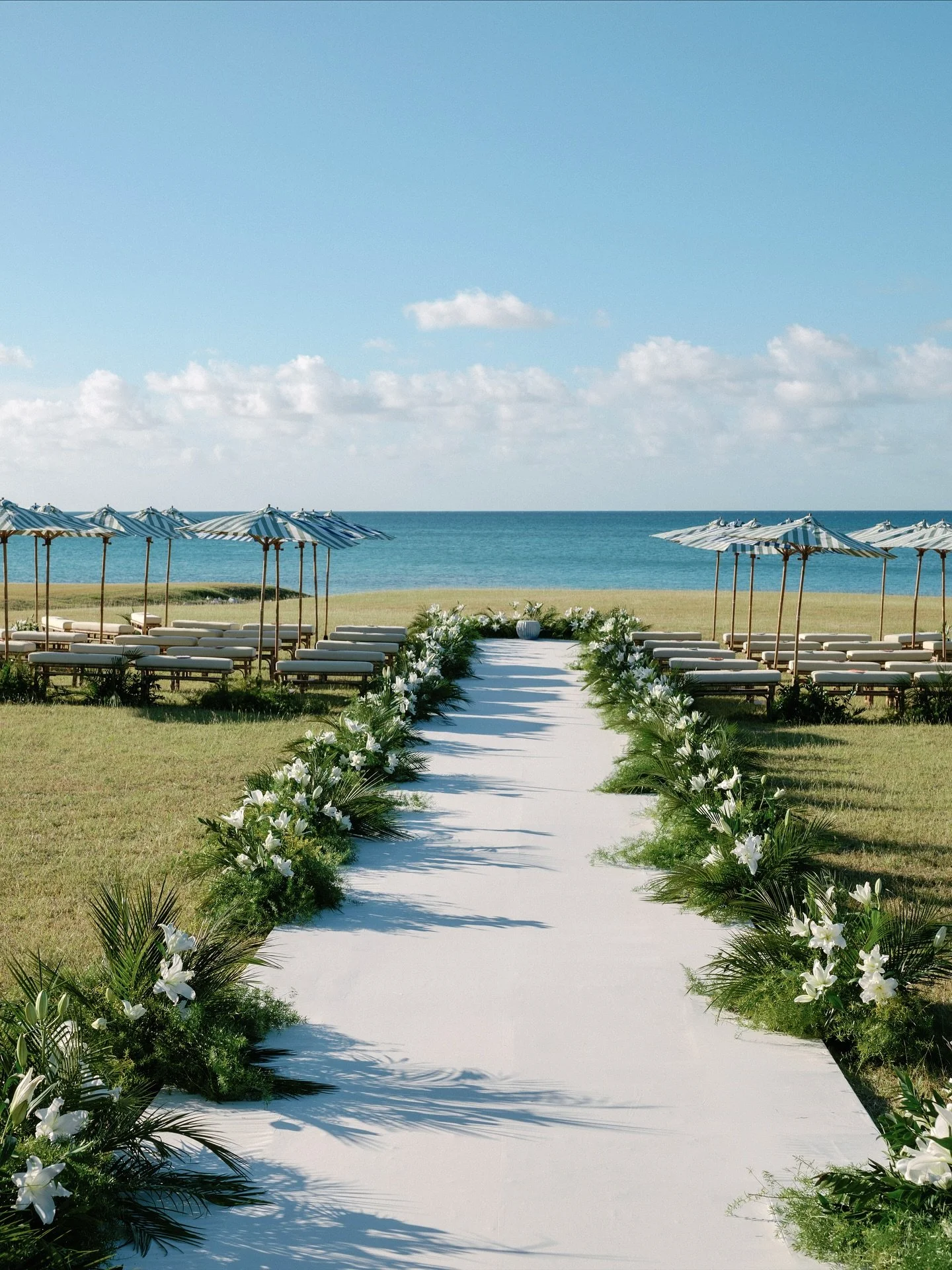 Floral lined aisle for K&amp;J with custom embroidered detailing and of course, stripes! Loved how @bethhelmstetter incorporated the couple&rsquo;s love for all things striped into each wedding day space from ceremony to cocktail hour and reception t