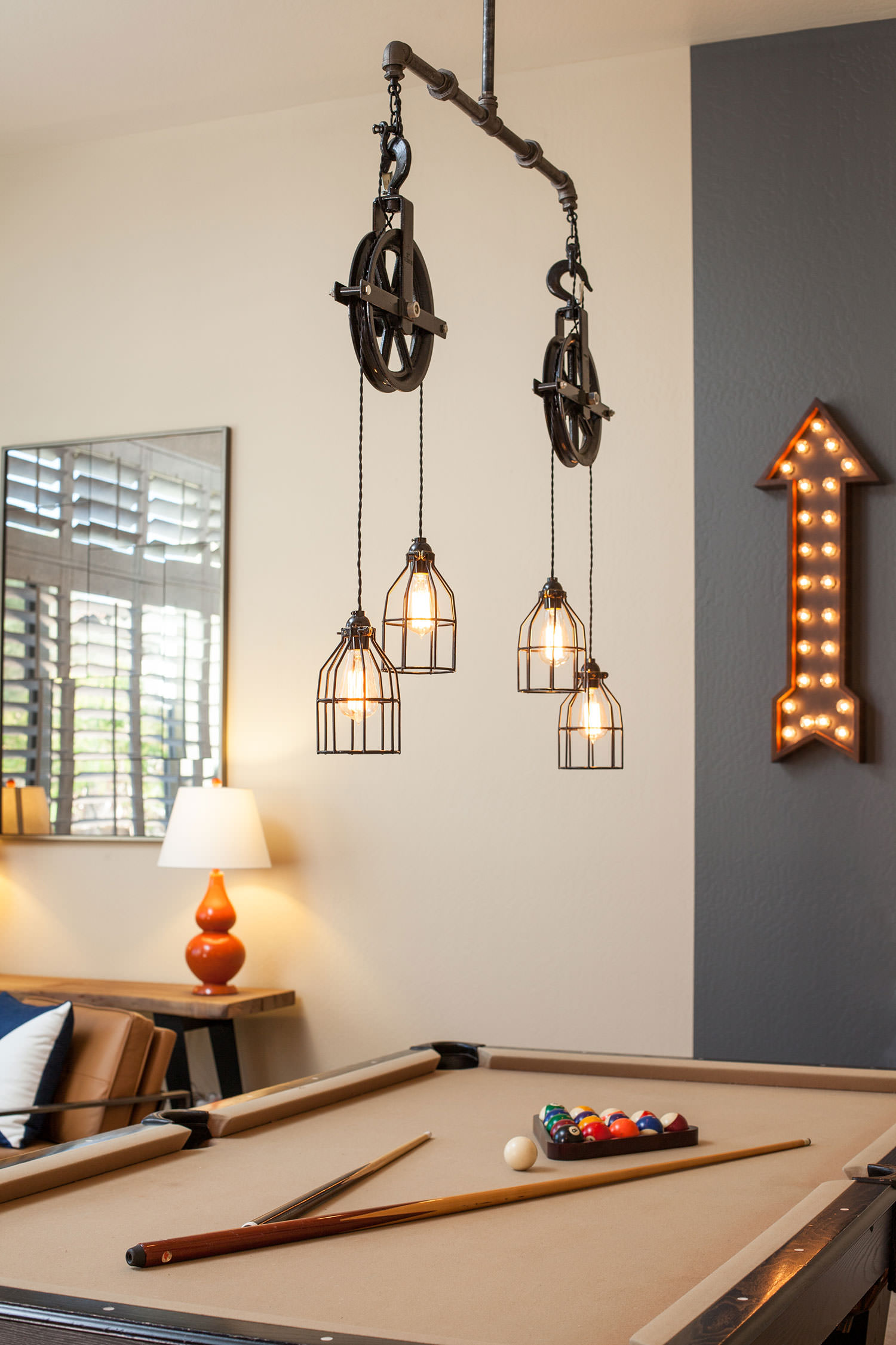 Layer rustic light fixtures with vintage decor for retro inspired design. Image: James Stewart