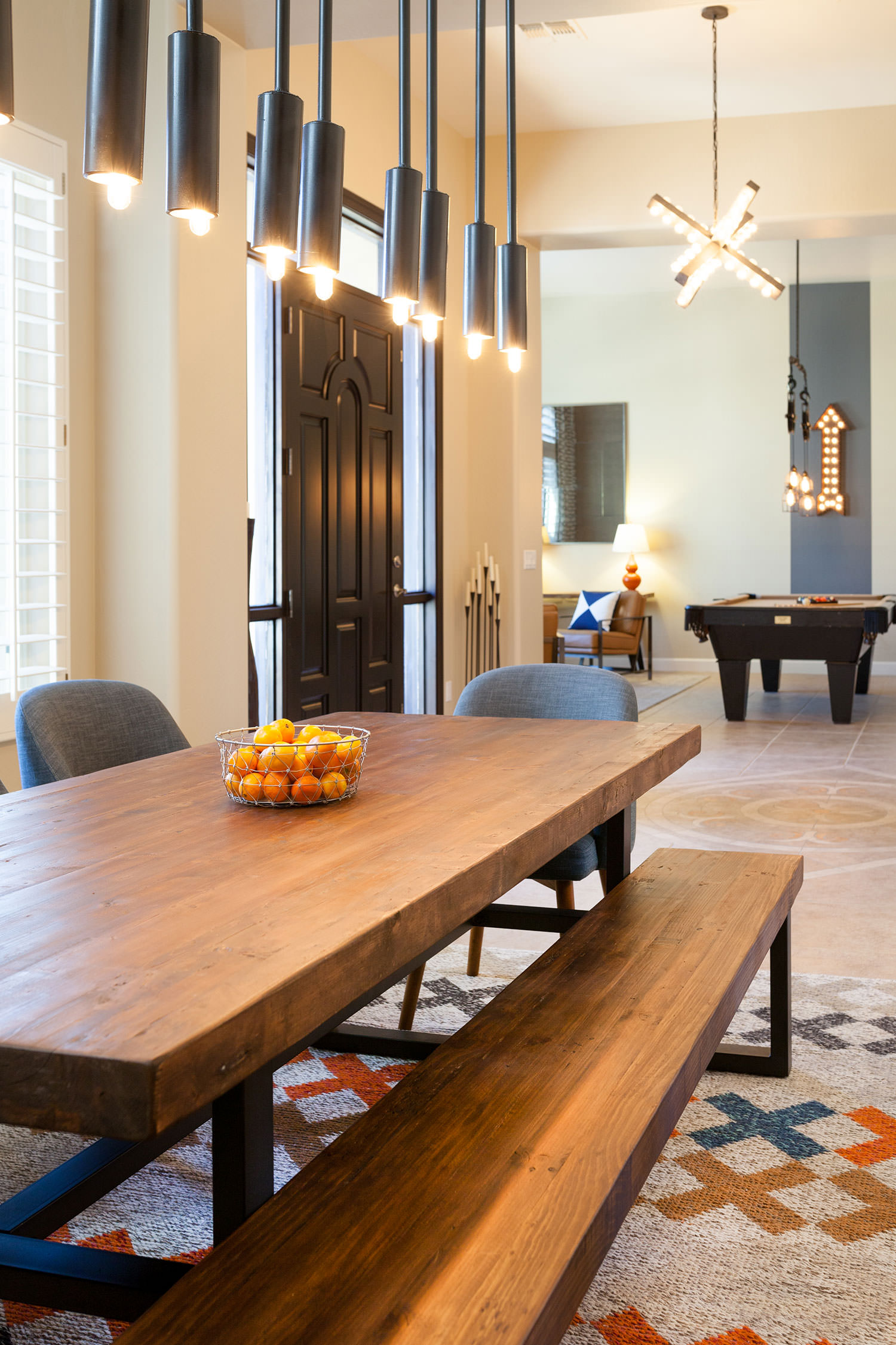 A one-of-a-kind light fixture is the focal point of this dining space. Image: James Stewart