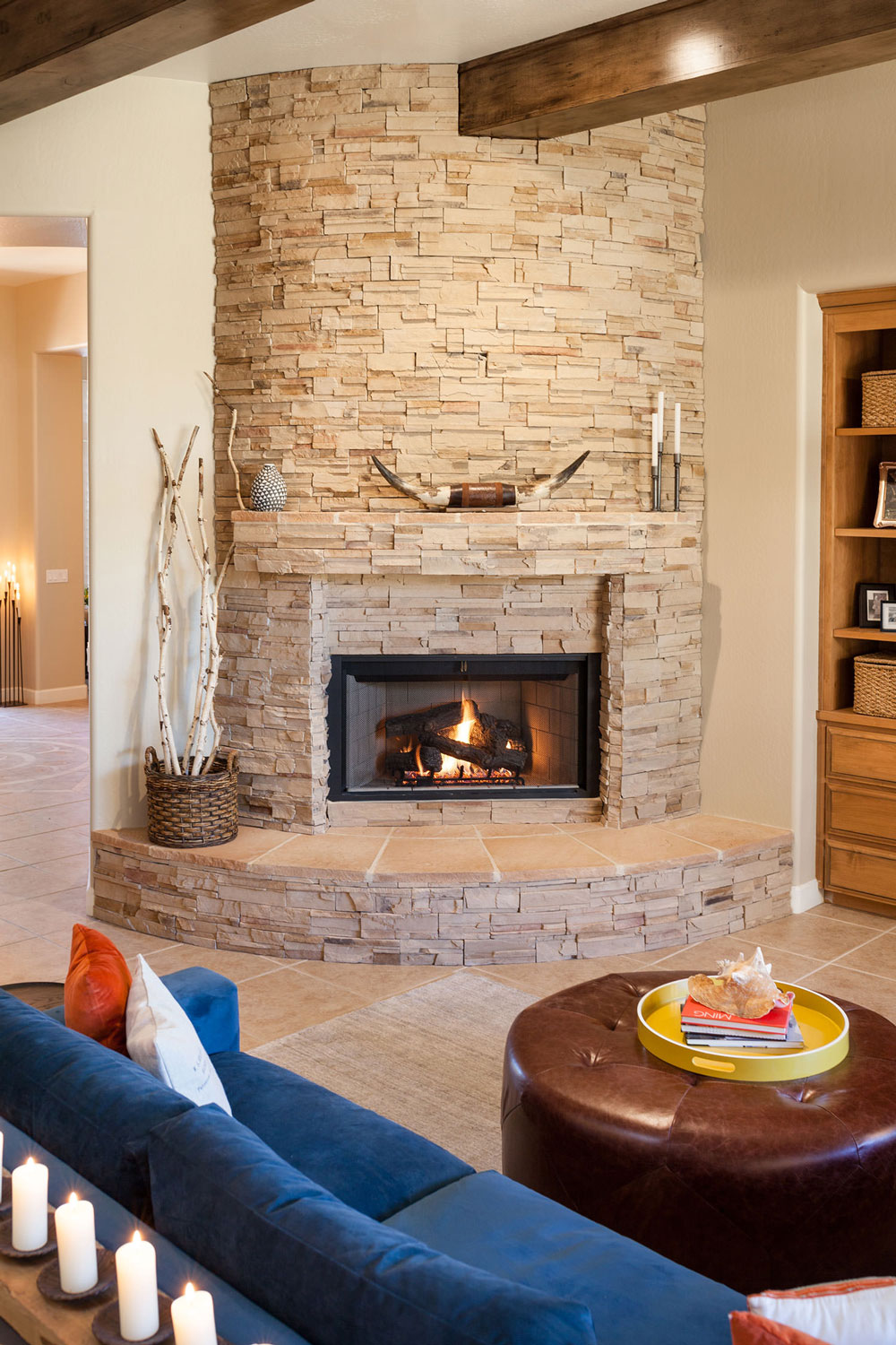 The fireplace becomes a focal point in this rustic living space. Image: James Stewart
