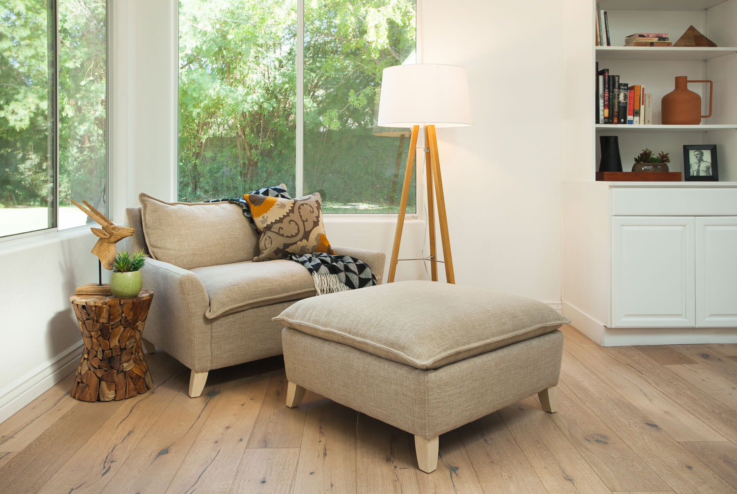 The perfect destination to kick back with a book. This mid century floor lamp gives a warm glow to a cozy corner. Image: James Stewart