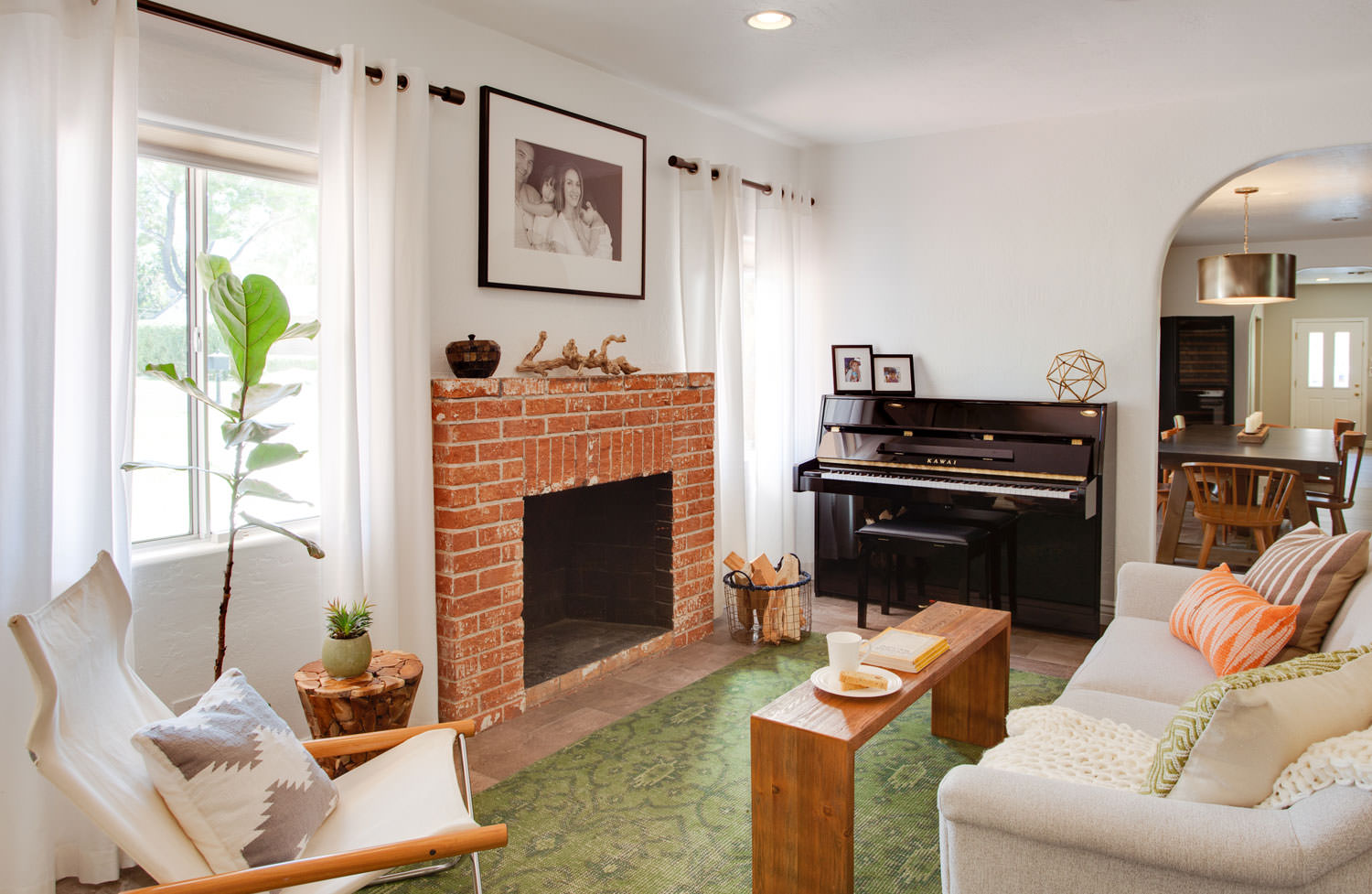 The modern elements of this wood bench act as a unique coffee table in an eclectic ranch style home. Image: James Stewart