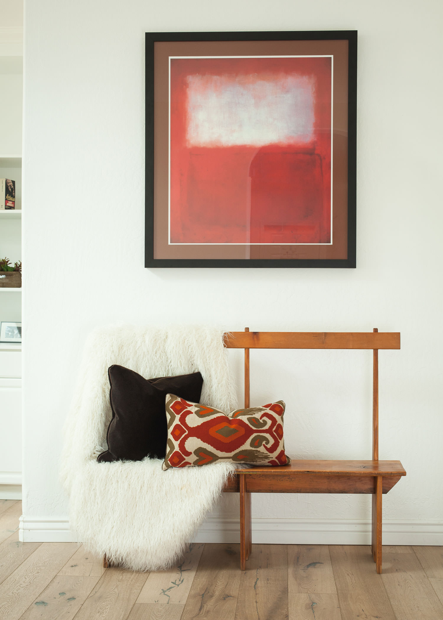 Use bold artwork against pops of color and texture to form a beautiful bohemian design. Image: James Stewart