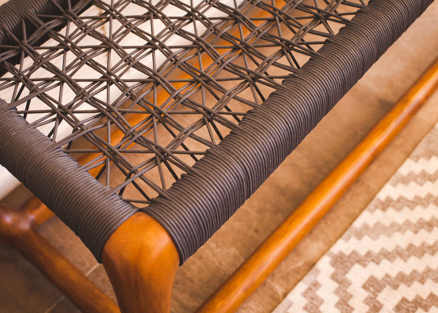 Even the small details can make a big impact. This bohemian inspired bench is the perfect place to take off your shoes and get comfortable. Image: James Stewart