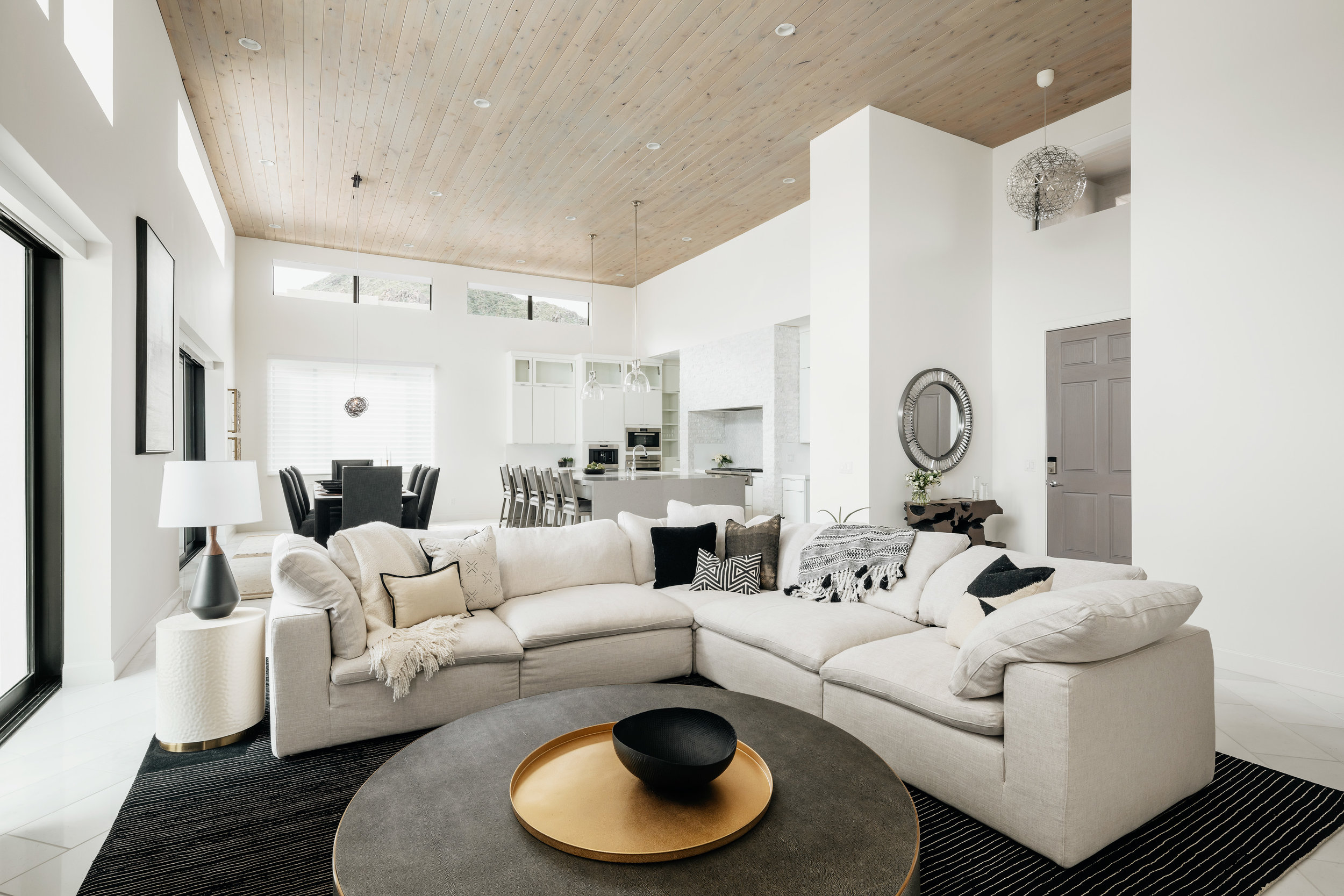 The textures of the darker concrete coffee table paired with metallic tray gives a pop of shine. Image: Roehner + Ryan