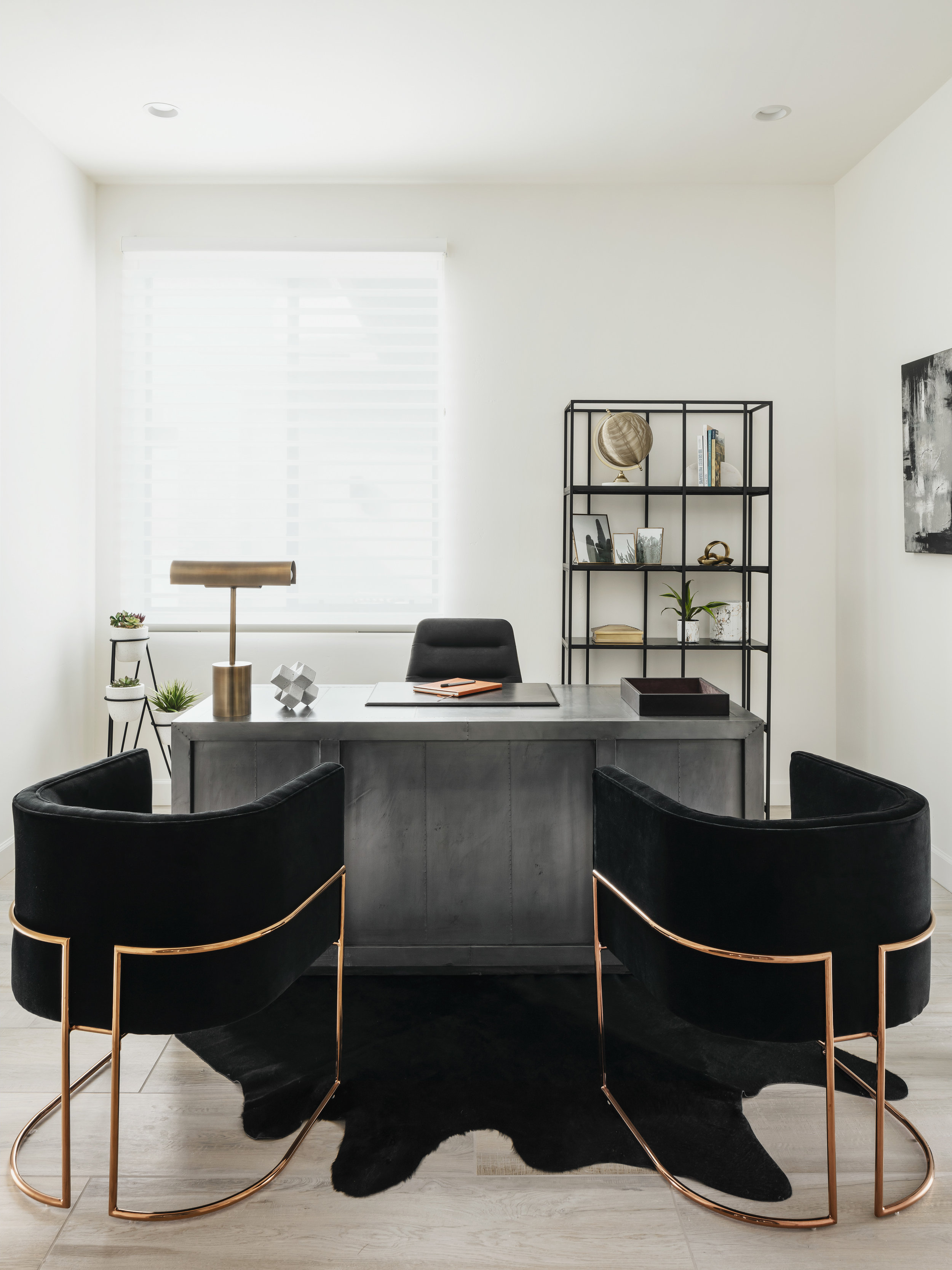 This modern office was designed with masculine touches using steel finishes, black fabric and clean lines. Simple, elegant and functional. Image: Roehner + Ryan