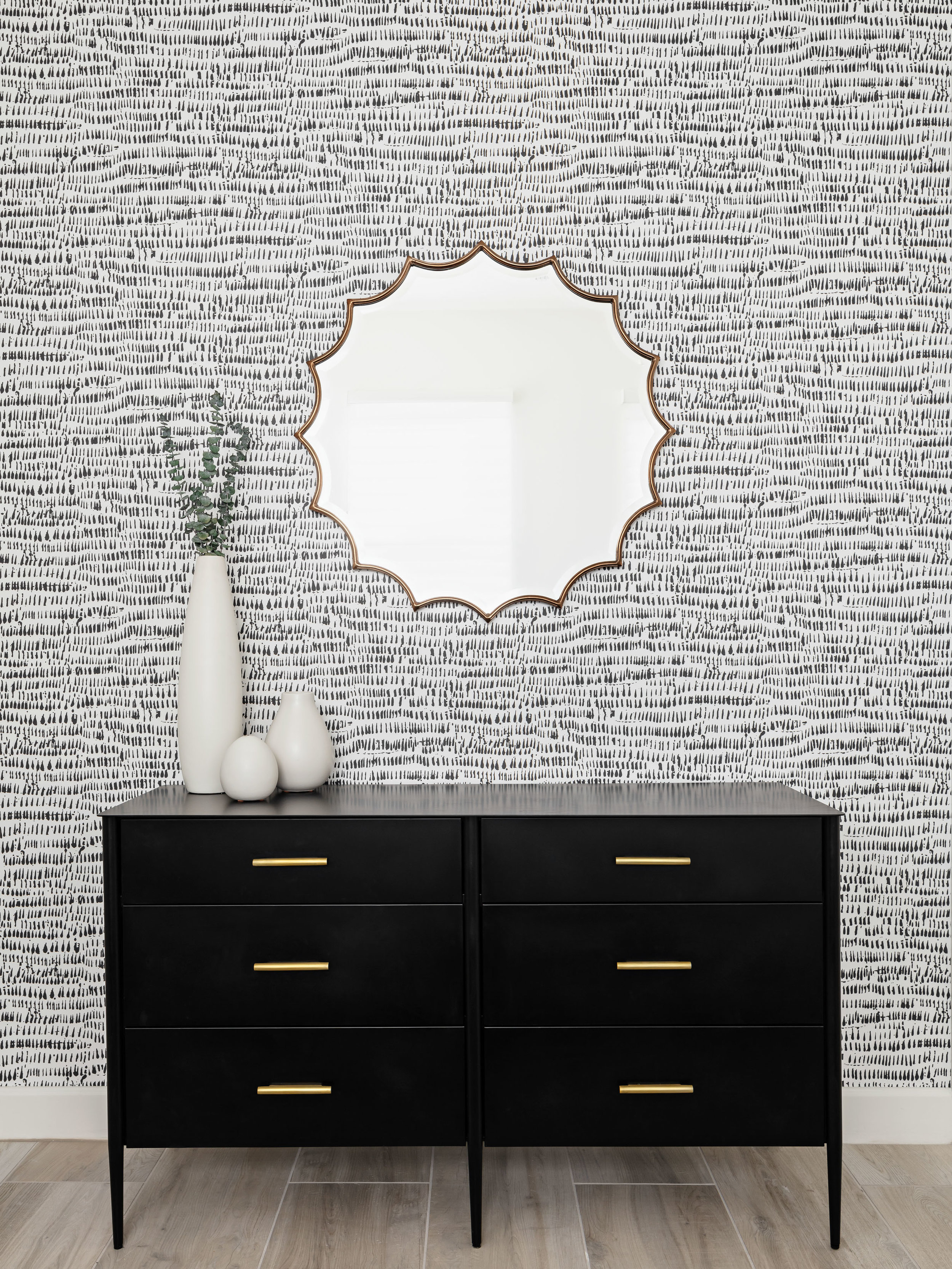 A minimally patterned black and white wallpaper adds the perfect touch of depth and interest to this sleek bedroom design. Image: Roehner + Ryan