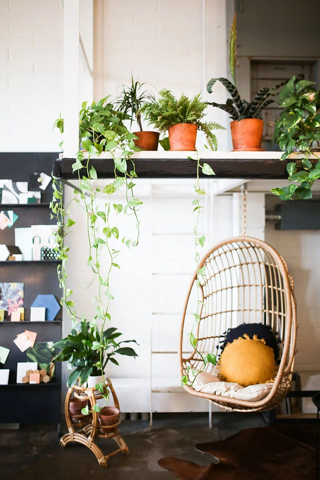 Work here, work there, work everywhere. This swing chair is the perfect focal point in this interior design office. Andrew and Ada Photography Andrewandada.com @andrewandada