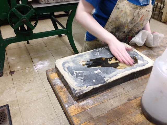  Next gum arabic is poured on the stone to seal the image and the stone.&nbsp;I have to make sure that the entire stone face and image are covered otherwise the next time I print, there could be holes in the image. 