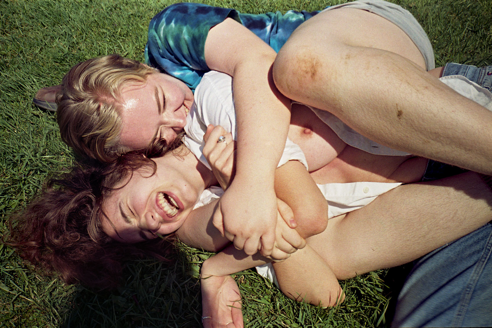   Ruby and Karlyn in the grass, 2018.    © Cameron Schiller  