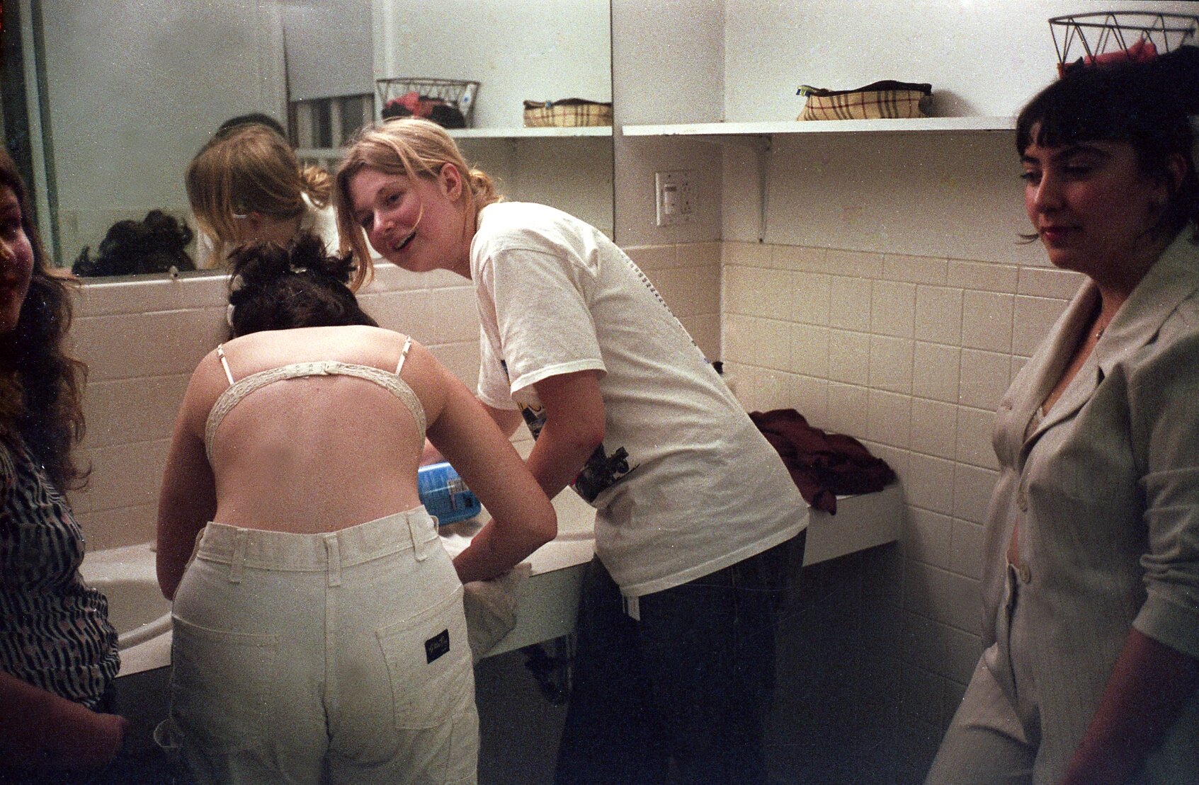   Girls in the bathroom, 2019.    © Cameron Schiller  