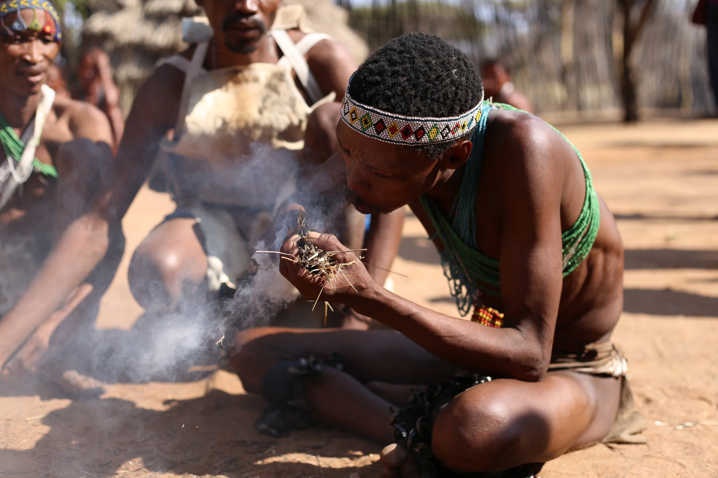 Building a traditional bushmen fire.