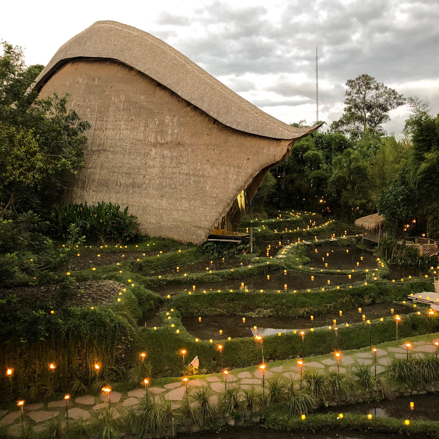 The Kapal Bamboo store on the John Hardy Compound where I work. Kapal Bamboo’s design mimics a boat and the name actually means “Bamboo Ship” in Bahasa Indonesia. This structure is made from Bamboo and is a true architectural masterpiece! I took this photo before sunset during a ‘firefly dinner’. As you can see the candles light up the night as fireflies do.