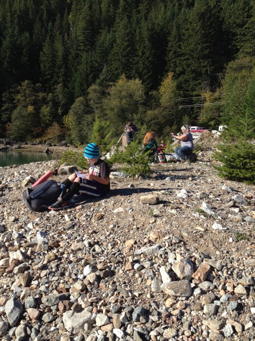 Students learning about water cycles on the beach of Diablo Lake.