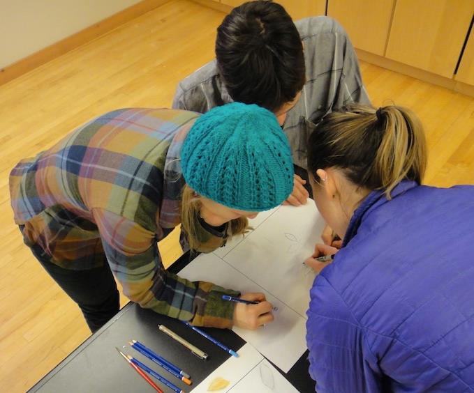 Emily (left), Aly (right) and Joe (top) working hard on their “Liquid Sunshine” map. Photo courtesy of Véronique from her blog post of that day.