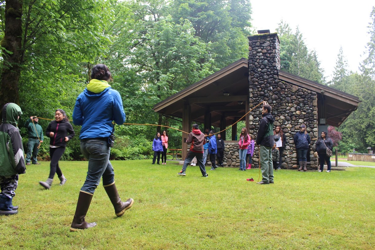 Sasha, in the blue, instructing the Salmon Run game.