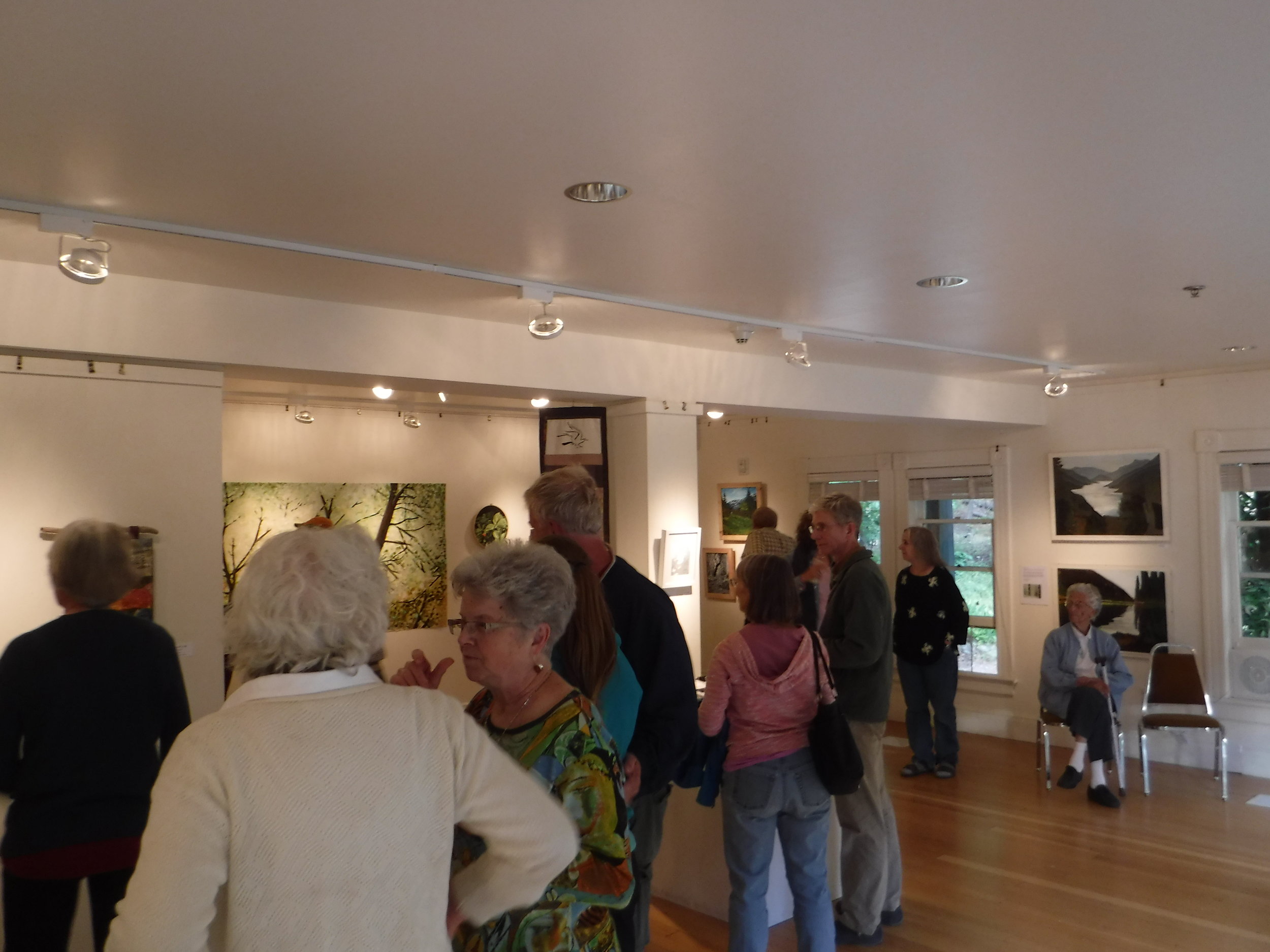 Art show in the valley (one of the Buckner sisters is sitting in the chair).