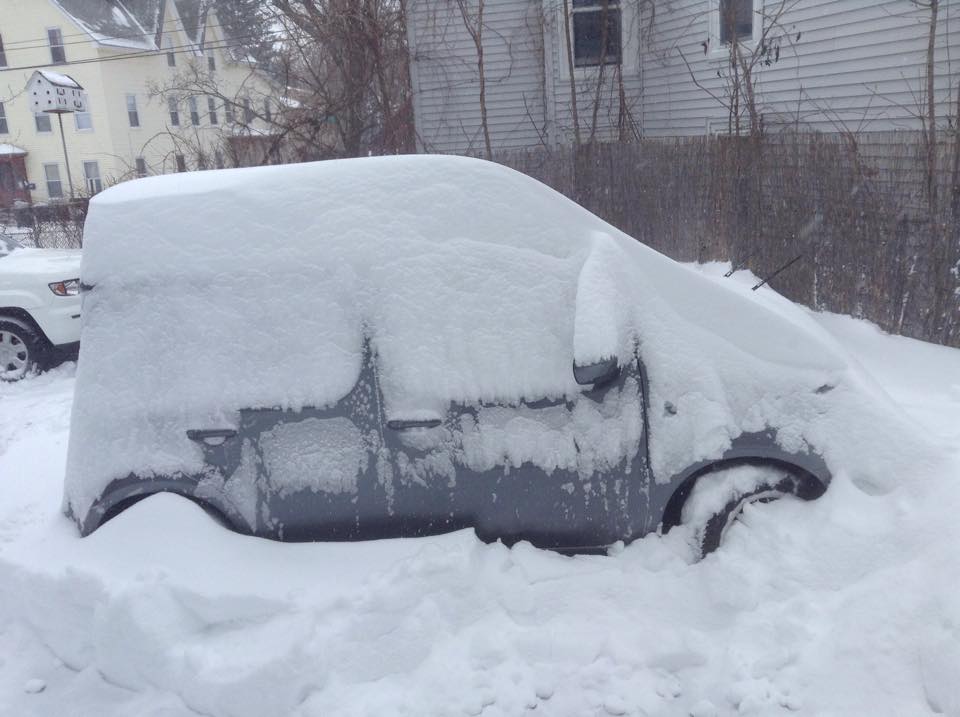 Snow piling up on my car in Manchester, NH