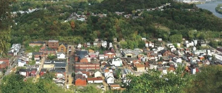 Millvale nestled in the valley, with the Allegheny running to the south. Photo courtesy of Millvale Borough.
