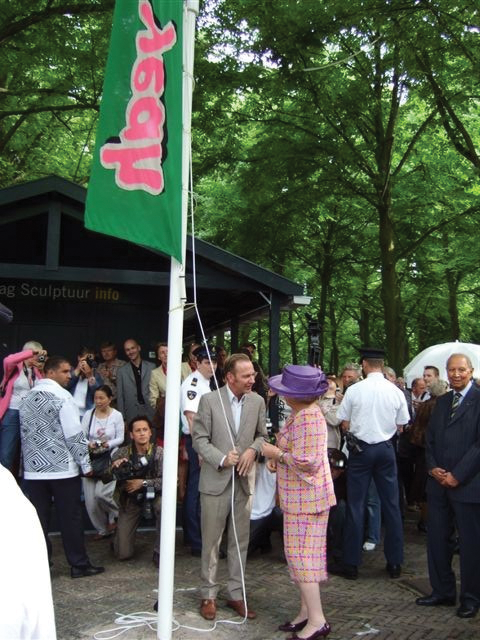 Queen Beatrix of the Netherlands raises the ‘yeah’ flag as part of the exhibition, DeOverkant Downunder.
