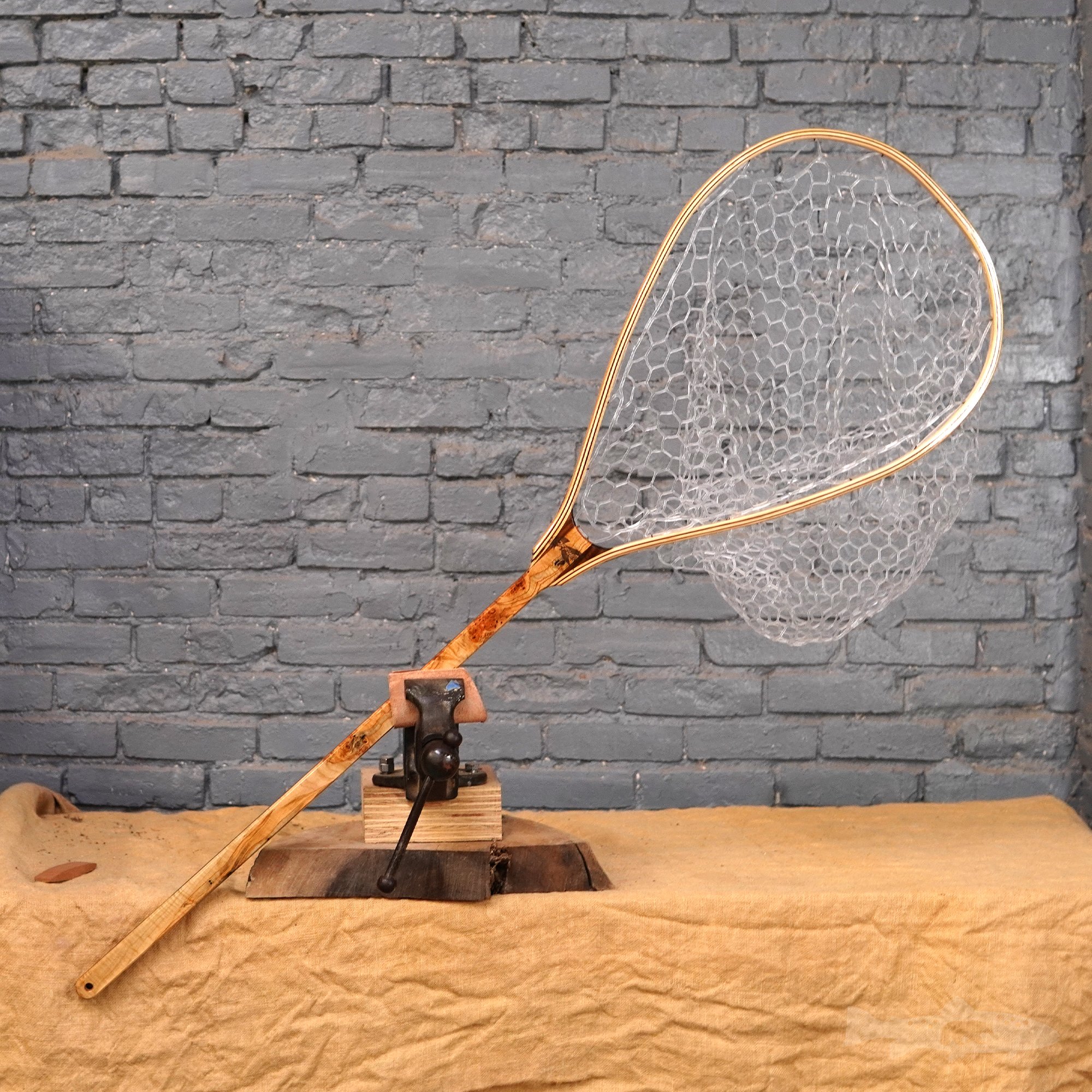 large fly fishing net with object inlayed into handle. These are