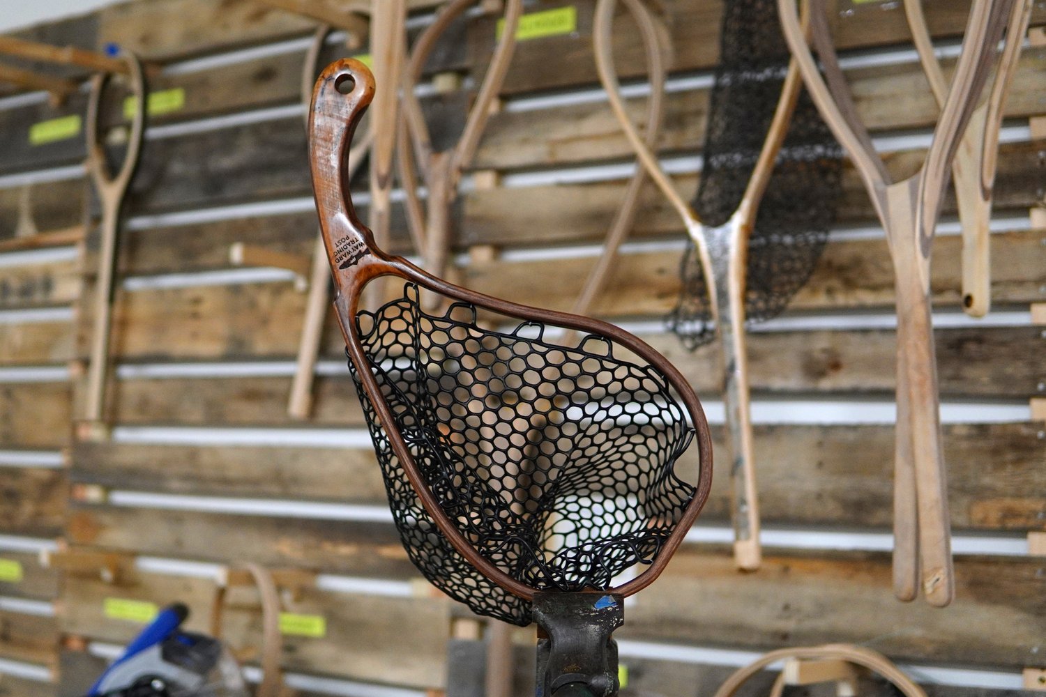Handcrafted, asymmetrical crescent landing net for trout fly
