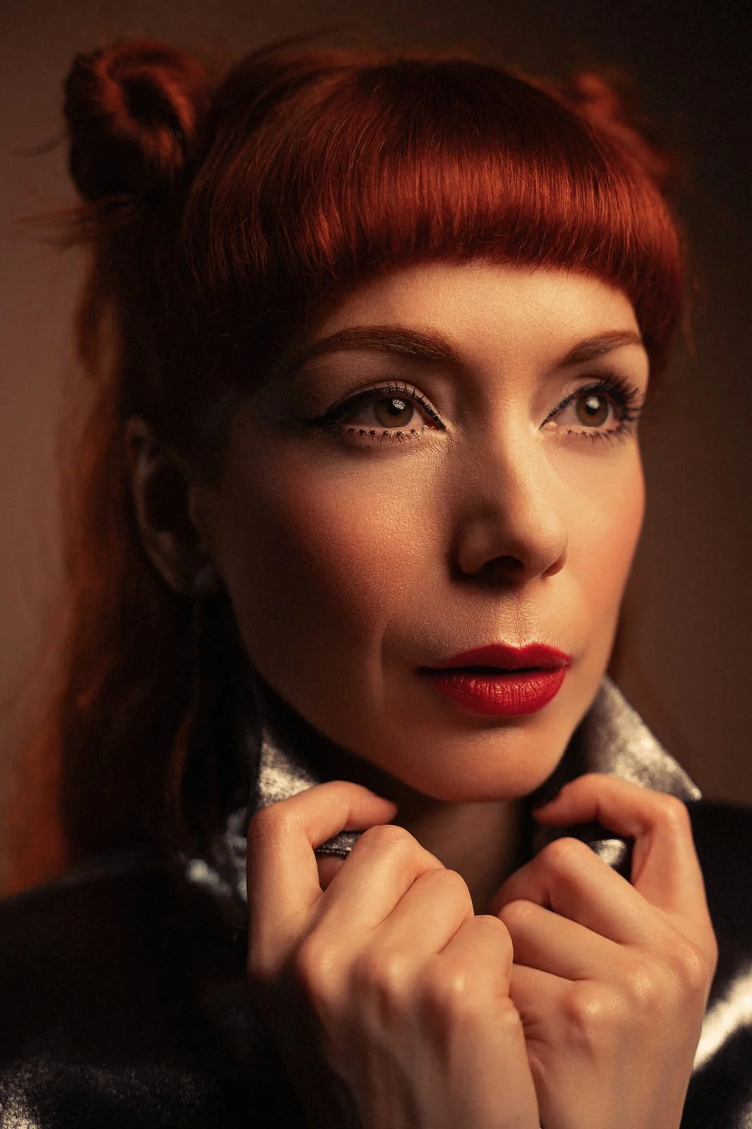The Anchoress close portrait with space buns hairstyle