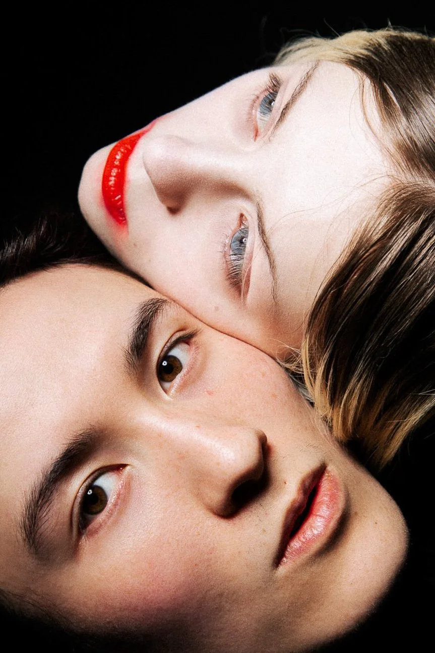 Close-up portrait of a couple in studio with contrast lighting