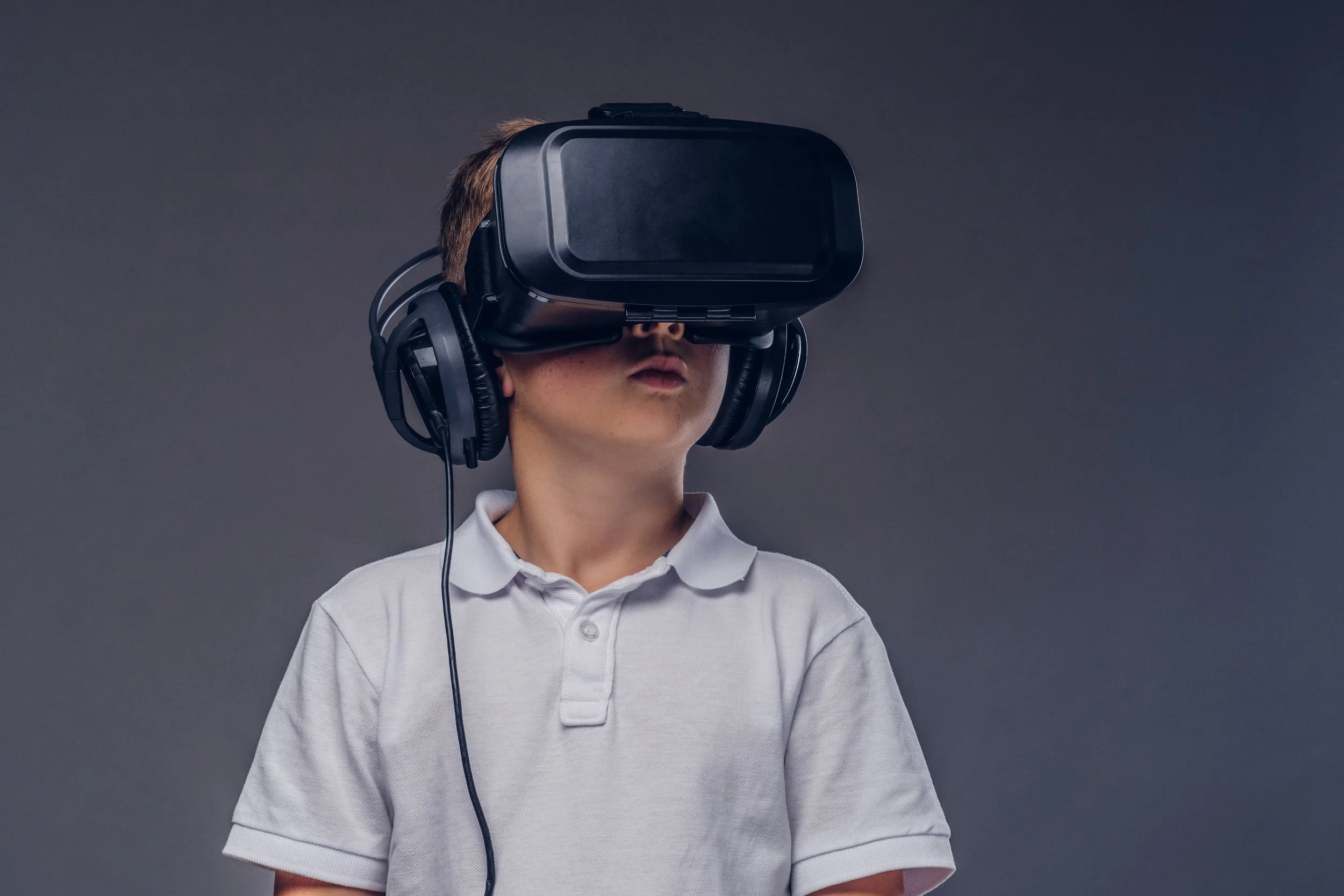 child-wearing-virtual-reality-headset-and-headphon-2026-09-23-03-27-50-utc.jpg