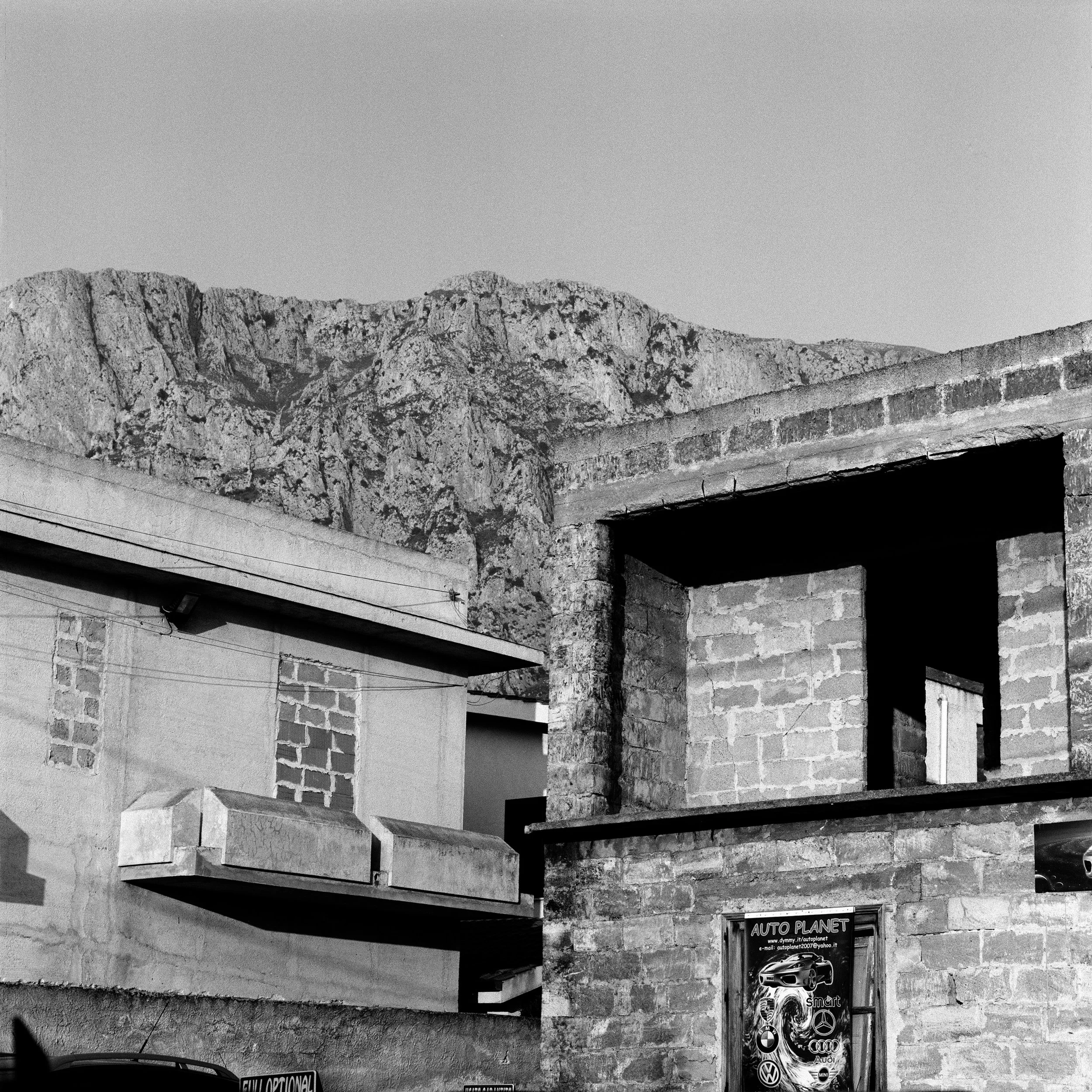  Muted buildings in Cinisi, the village near Palermo where Peppino Impastato was brutalised by the Badalamenti's hit men.  