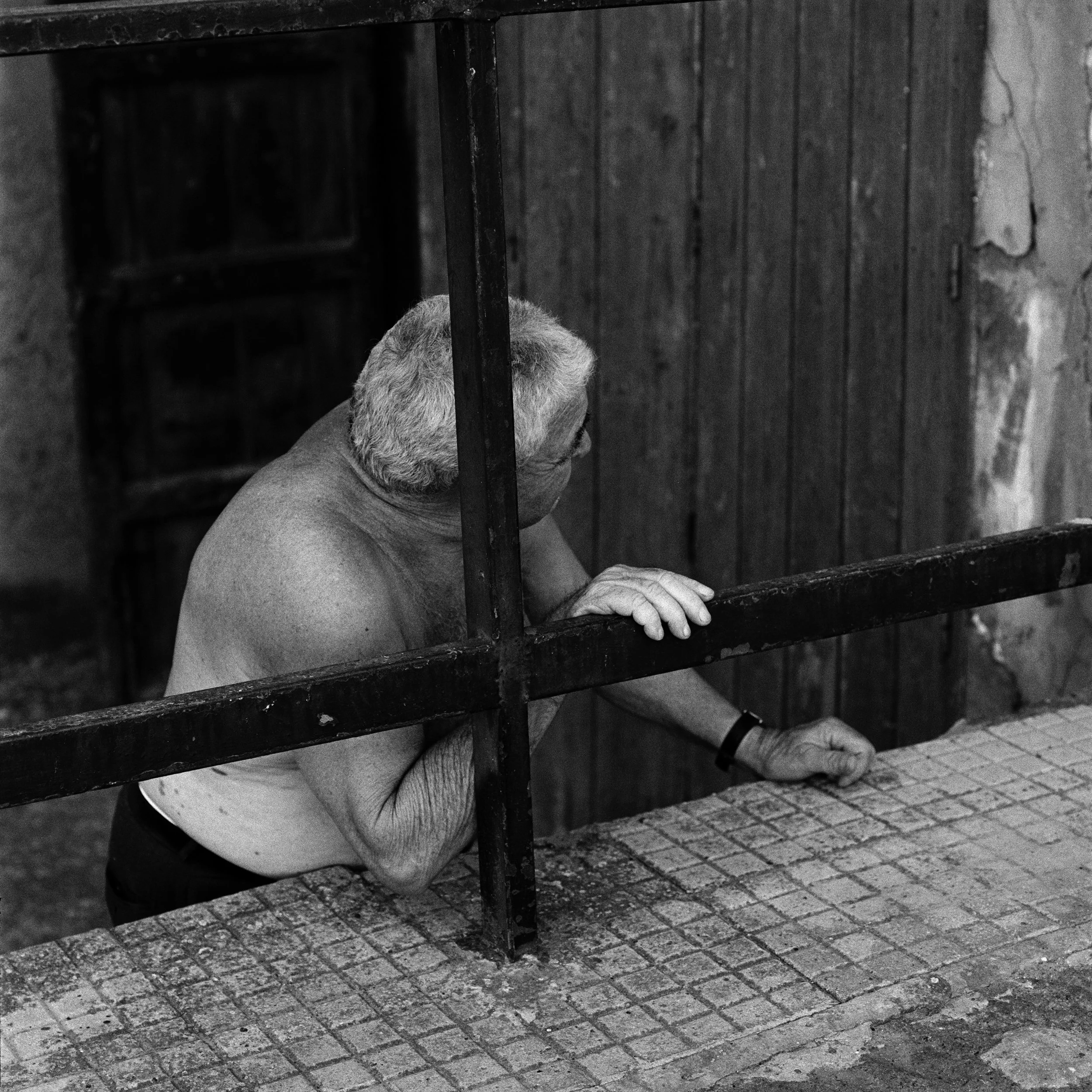  Man outside his home in Palma di Montechiaro on the south coast of Sicily 
