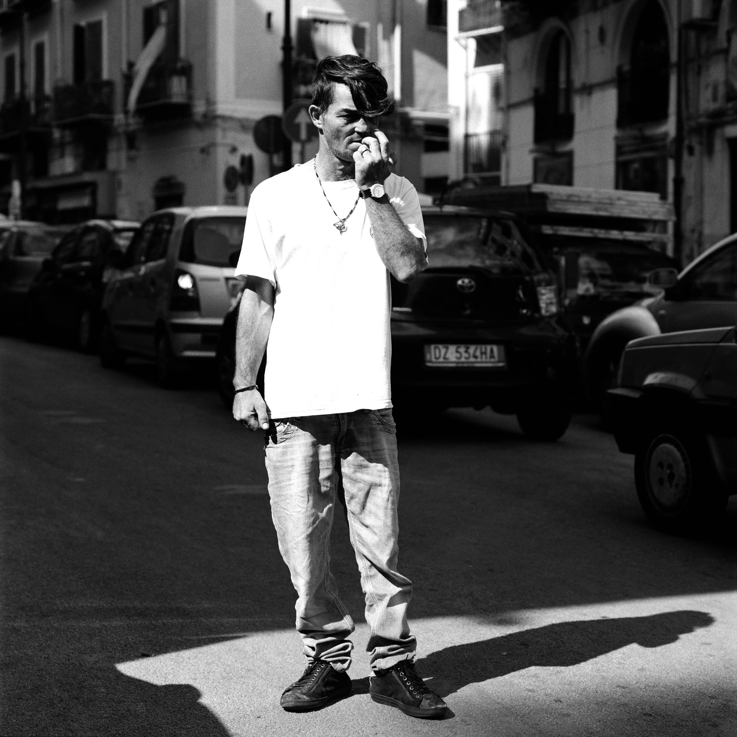  An unauthorized  parking attendant looks out for cars in search for a parking spot near Palermo's Central Station. September 2016 