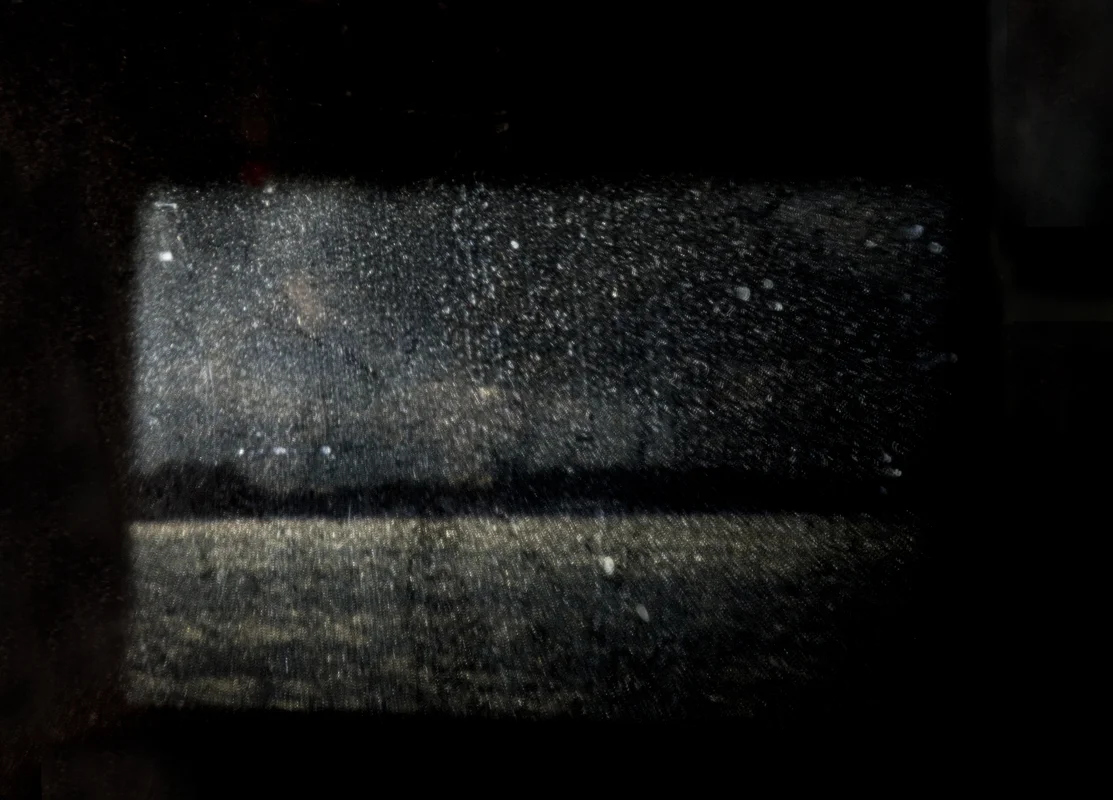 In the darkening of the light