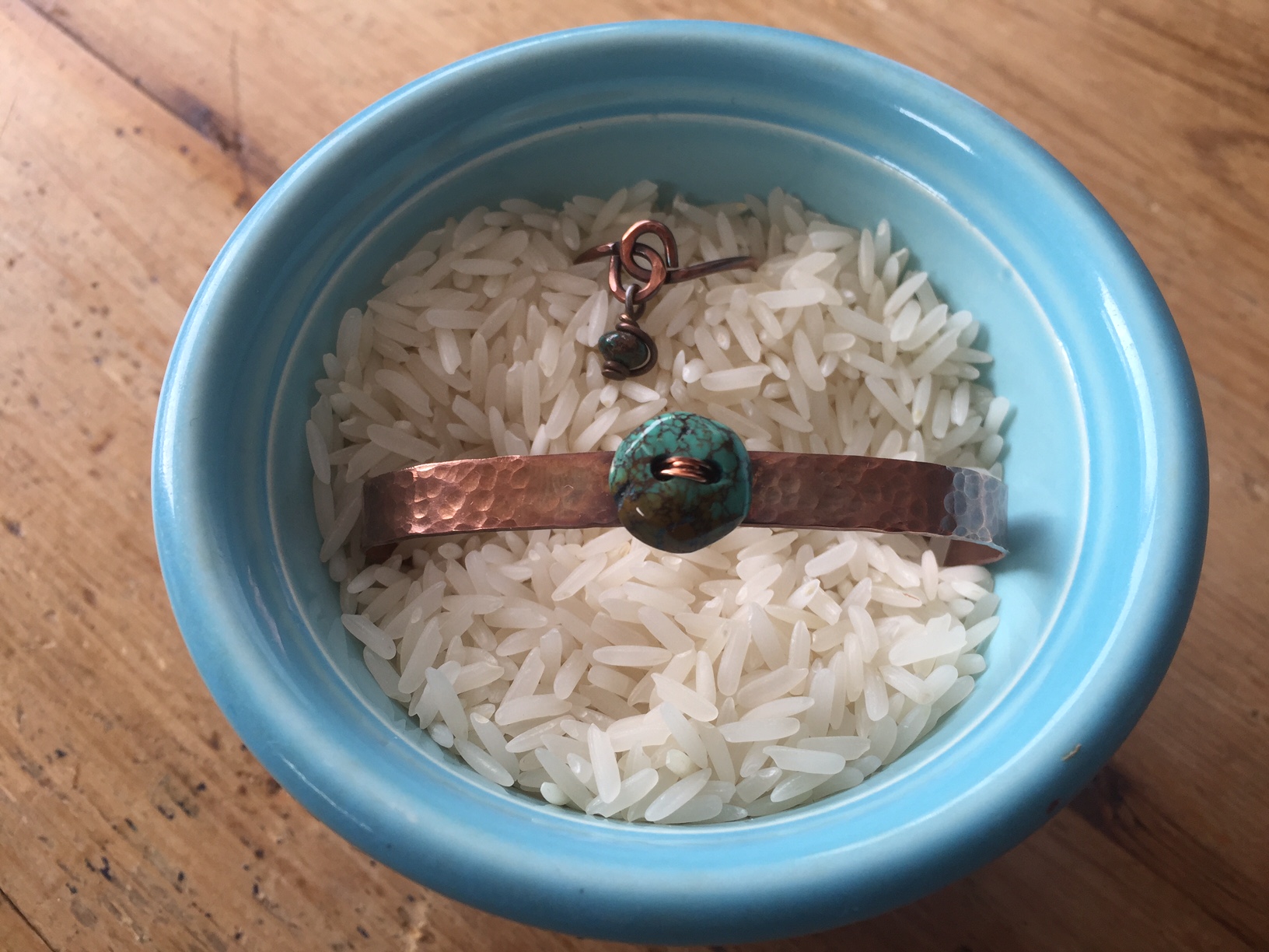 Hammered and Antiqued Copper Cuff with Turquoise button and a copper wrapped ring with Turquoise dangle bead.