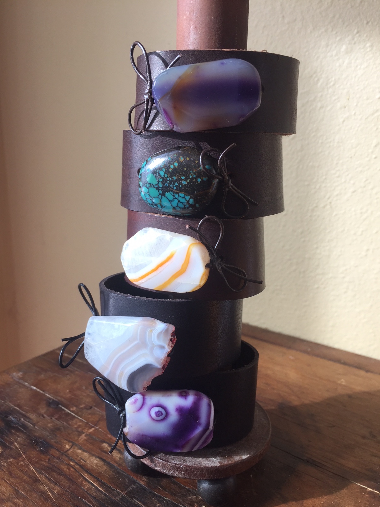 Artisan crafted leather bracelet with colored stones